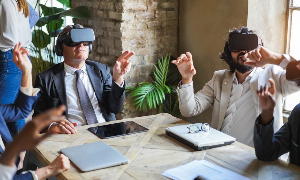 Business people wearing vr goggles inside office - New AI technology and metaverse concept